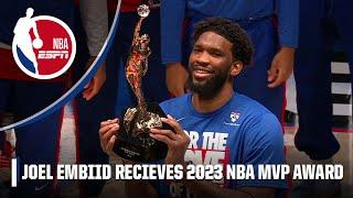Joel Embiid lifts 2023 NBA MVP trophy with Adam Silver and family