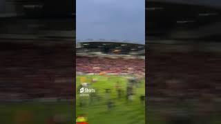 Wrexham fans storm the pitch after securing promotion