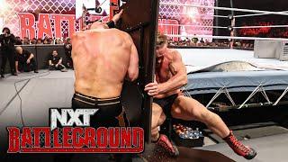 Ilja Dragunov runs through a table to attack Dijak: NXT Battleground 2023 highlights